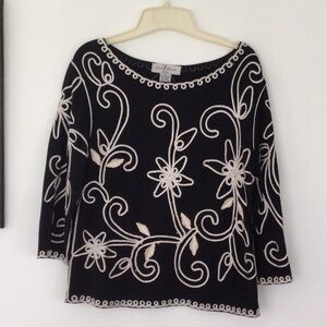 Woman’s Top by Once Agatha size petite L 65 % polyester color black& sliver  #95